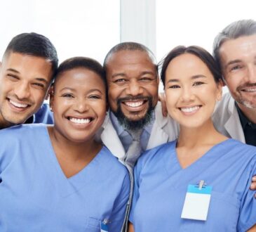 A group of medical professionals posing for a photo Description automatically generated